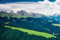 Beautiful green grassland , snow mountains and forests Royalty Free Stock Photo