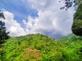 Beautiful Green Hills Mountain With Trees an Blue Sky with Clouds in the Summer Forrest Royalty Free Stock Photo
