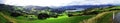 Beautiful green landscape panorama bay oceanside sea hills and meadow woods -Porpoise Bay New Zealand Royalty Free Stock Photo