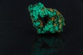 Beautiful green malachite on on a black background