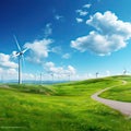 Beautiful green meadow with wind turbines generating electricity Royalty Free Stock Photo