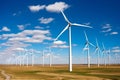 Beautiful green meadow with Wind turbines generating electricity Royalty Free Stock Photo