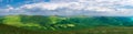 Beautiful green mountain panorama with blue sky above Royalty Free Stock Photo