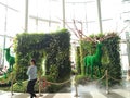 Beautiful green stags in a garden setting inside a mall in Thailand