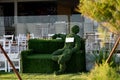 Beautiful green topiary figure in a park in Cyprus city at sunlight