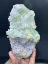 Beautiful green tourmaline elbaite bluster with lepidolite and quartz mineral specimen from Afghanistan Royalty Free Stock Photo