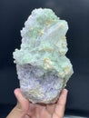 Beautiful green tourmaline elbaite bluster with lepidolite and quartz mineral specimen from Afghanistan Royalty Free Stock Photo