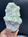 Beautiful green tourmaline elbaite bluster with lepidolite and quartz mineral specimen from Afghanistan Royalty Free Stock Photo