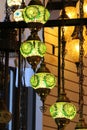 Beautiful green Turkish lamps glow with soft luminescence in a store in Solvang, CA.