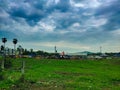 Beautiful Green Village Market Place on Evening with Dark Monsoon Passing Clouds Background Royalty Free Stock Photo