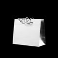 Beautiful grey gift bag. Close up. Isolated on black background