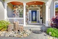 Beautiful grey new classic home entrance exterior with natural stone.