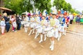 a beautiful group of girls in a hussar uniform playing drums and leading a festive procession at a flower festival on a summer da