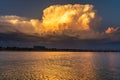 Towering Sunset Thunderstorm over a Lake