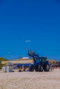 White seagulls flying in the blue summer sky and tractor Royalty Free Stock Photo