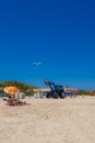 White seagulls flying in the blue summer sky and tractor Royalty Free Stock Photo