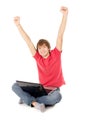 Beautiful guy sitting for the laptop and happy raising a hand in