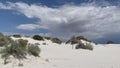 Beautiful gypsum dune vista at the White Sands National Park set against dramatic sky during the monsoon season, New Mexi