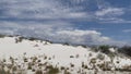 Beautiful gypsum dune vista at the White Sands National Park set against dramatic sky during the monsoon season, New Mexi