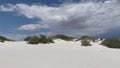 Beautiful gypsum dune vista at the White Sands National Park set against dramatic sky during the monsoon season, New Mexi
