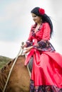 Beautiful gypsy girl riding a horse Royalty Free Stock Photo