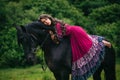 Beautiful gypsy in violet dress