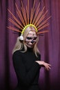 Halloween Make-Up Style, Fancy Dress and Diadem. Blond Model Wear Sugar Skull Makeup with Crown. Santa Muerte concept Royalty Free Stock Photo