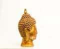 A beautiful hand-carved wooden Buddha head painted in gold
