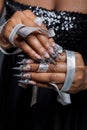 Beautiful hand of the girl with dark skin graft of acrylic nails with nail unusual fotmoy Royalty Free Stock Photo