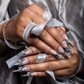 Beautiful hand of the girl with dark skin graft of acrylic nails with nail unusual fotmoy Royalty Free Stock Photo