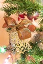 Beautiful hand made bell with bow on Christmas Tree Royalty Free Stock Photo