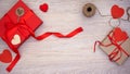 Beautiful hand-made giftboxes with red paper hearts on wooden background present Royalty Free Stock Photo