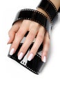 Beautiful hand with manicure and photo film