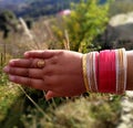 Beautiful hand newlymarried Himachali girl with their colourful bangel and gold jwellery Royalty Free Stock Photo