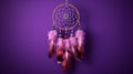 Beautiful handmade dream catcher on purple wall, closeup. Space for text