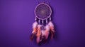 Beautiful handmade dream catcher on purple wall, closeup. Space for text