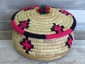 Beautiful Handmade Woven Bamboo / Cane Basket / box with Colourful Woollen Elements. Royalty Free Stock Photo