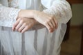 Beautiful hands, hands of the bride in wedding dress