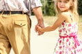 Beautiful hands of parent and child on sea background Royalty Free Stock Photo