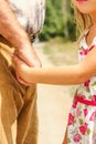 Beautiful hands of parent and child on sea background Royalty Free Stock Photo