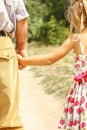 Beautiful hands of parent and child on sea background Royalty Free Stock Photo