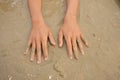 Beautiful hands on the sand