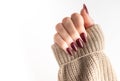 Hands of a young woman with dark red manicure on nails Royalty Free Stock Photo