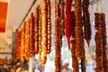 A beautiful, hanging, multi-colored Churchkhela on the counter of the market in the Kemer, Turkey. Traditional Turkish homemade Royalty Free Stock Photo