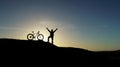 A beautiful happiness table deserved by a person who has peak success in the mountains with his bike Royalty Free Stock Photo