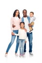 beautiful happy african american family with two children standing together and smiling at camera Royalty Free Stock Photo