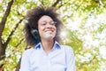 Beautiful Happy Afro American Young Woman Listening Music In Nature Royalty Free Stock Photo