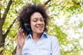 Beautiful Happy Afro American Young Woman Listening Music In Nature Royalty Free Stock Photo