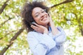 Beautiful Happy Afro American Young Woman Listening Music In Nature Royalty Free Stock Photo