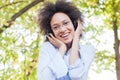 Beautiful Happy Afro American Young Woman Listening Music In Nature Royalty Free Stock Photo